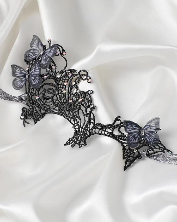 Black lace butterfly masquerade mask flat lay detail on satin