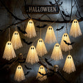 Halloween light-up ghost garland hanging from branches