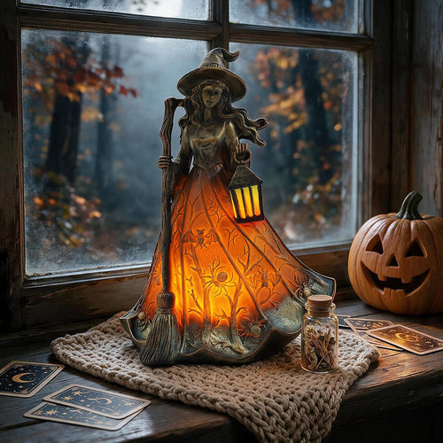 Gothic Halloween witch lamp on window sill with tarot cards