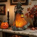 Gothic Halloween witch lamp lit on fireplace mantel