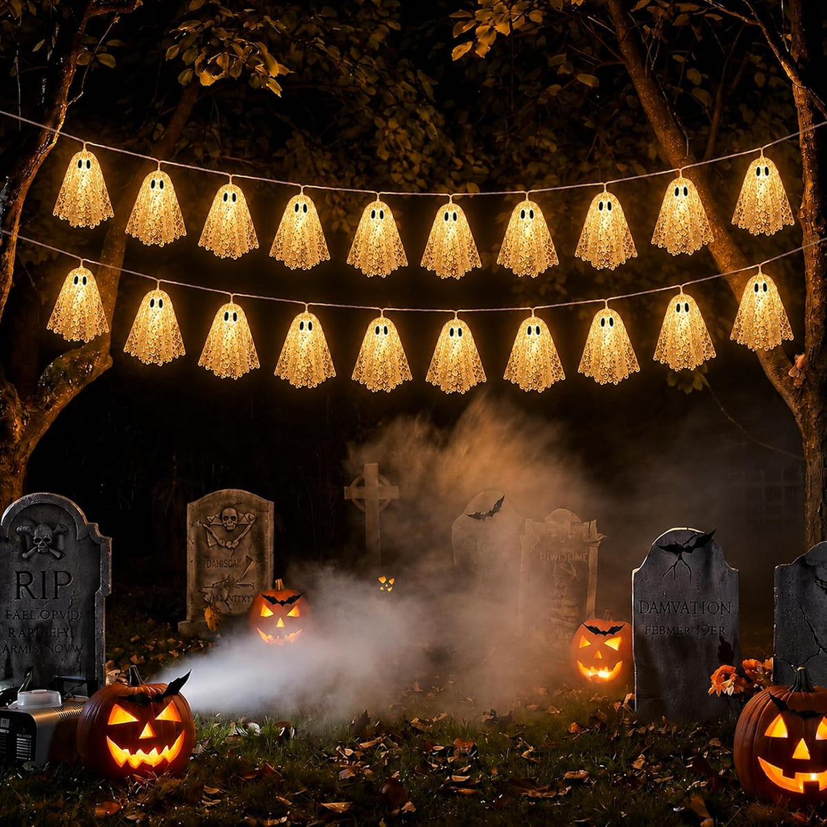 Two Halloween ghost garlands hanging in graveyard scene